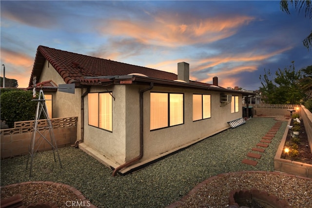 view of property exterior at dusk