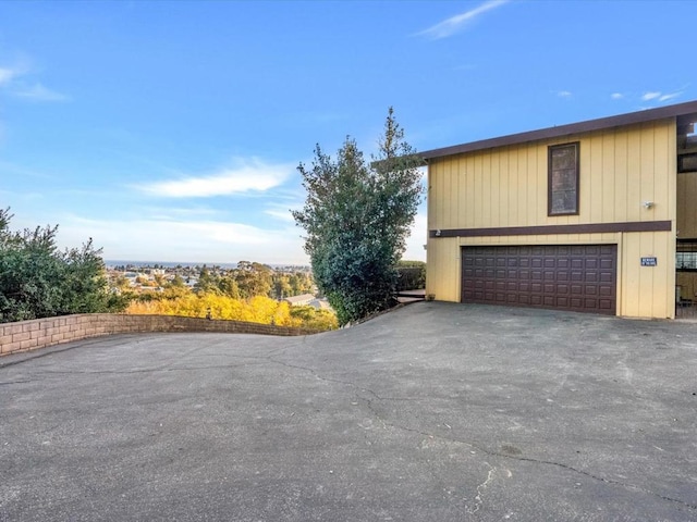 view of side of property with a garage