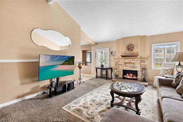 carpeted living room featuring lofted ceiling and a fireplace