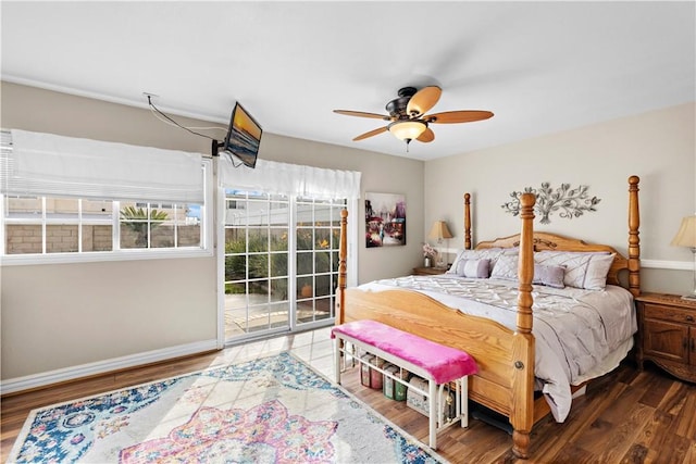 bedroom featuring dark hardwood / wood-style floors, access to exterior, and ceiling fan