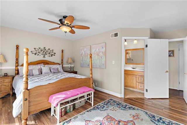 bedroom with connected bathroom, hardwood / wood-style floors, sink, and ceiling fan