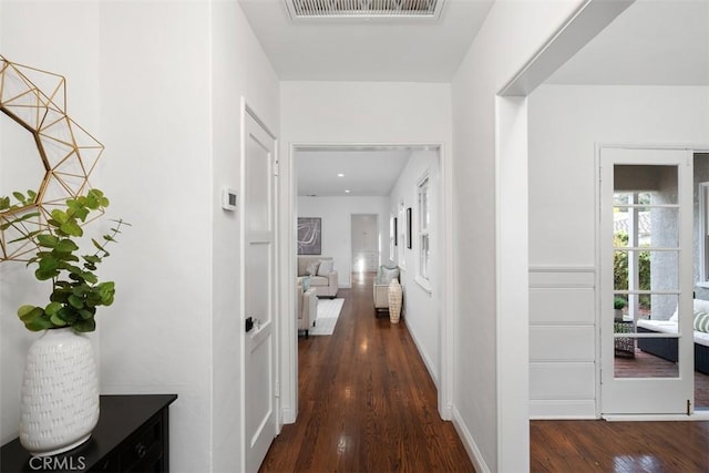 corridor featuring dark wood-type flooring