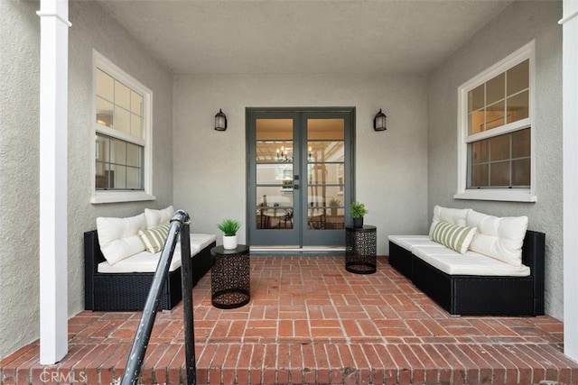 property entrance featuring french doors and a patio