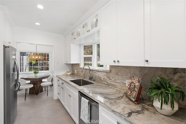 kitchen with white cabinetry, sink, and stainless steel appliances