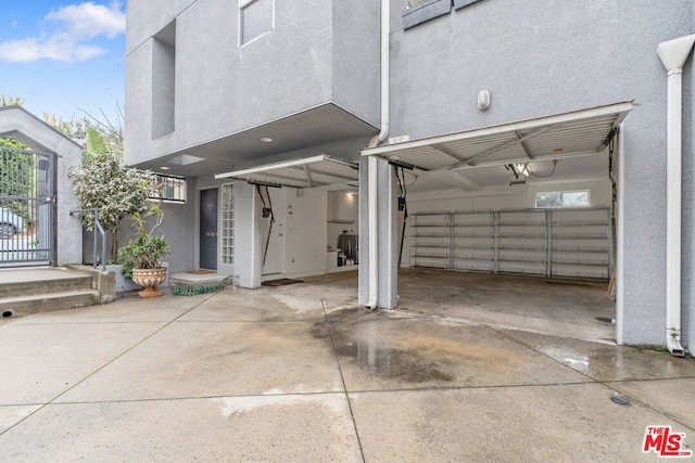 garage featuring a carport