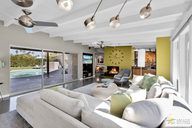 living room featuring beam ceiling, dark hardwood / wood-style floors, and ceiling fan