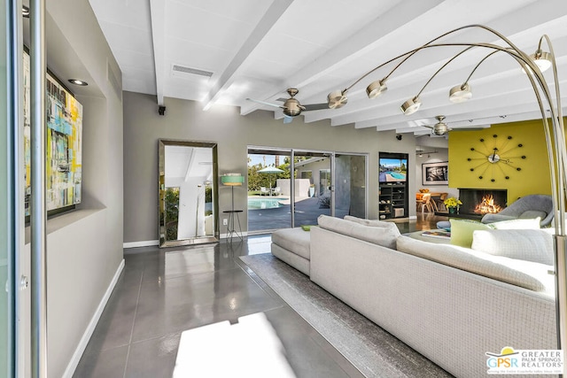 living room with ceiling fan and beam ceiling