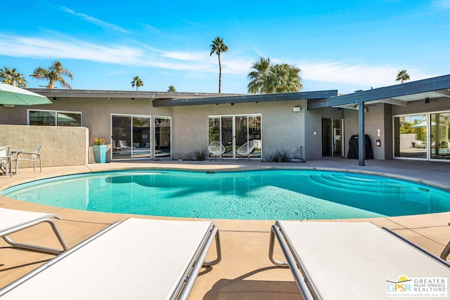 view of pool with a patio