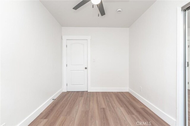 unfurnished room featuring ceiling fan and light hardwood / wood-style flooring