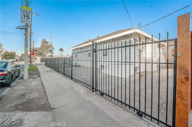 view of gate with fence