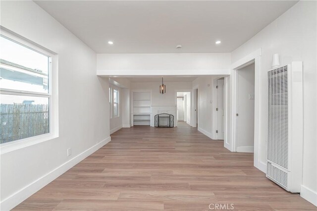 unfurnished living room featuring light hardwood / wood-style floors