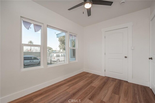 unfurnished room featuring hardwood / wood-style flooring and ceiling fan