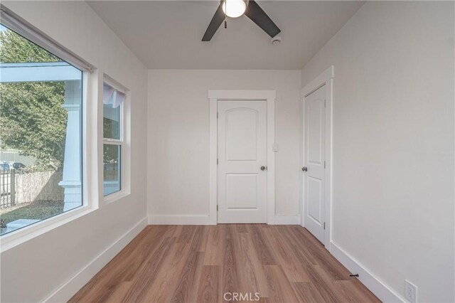 spare room featuring ceiling fan and light wood-type flooring