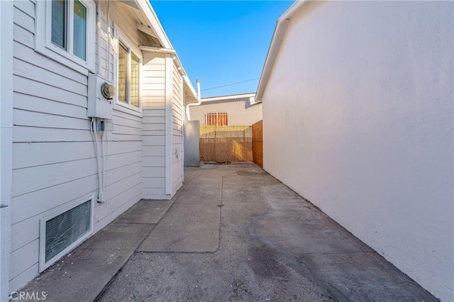 view of side of home with a patio area