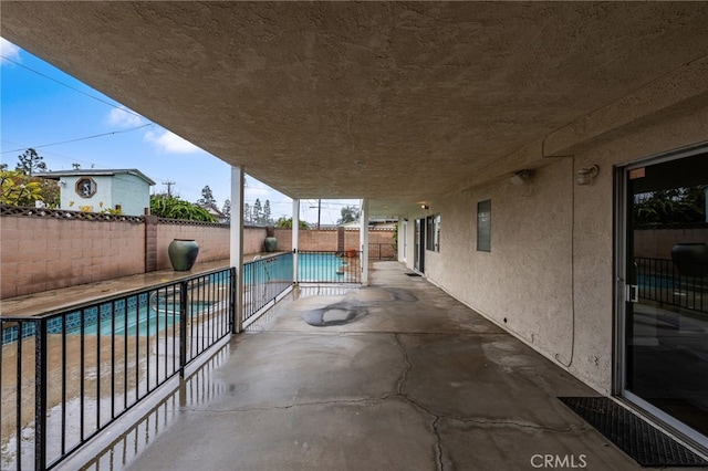 view of patio featuring a fenced in pool