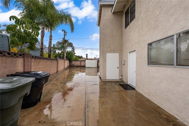 view of property exterior with a patio