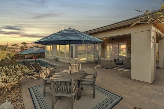 patio terrace at dusk with an outdoor living space