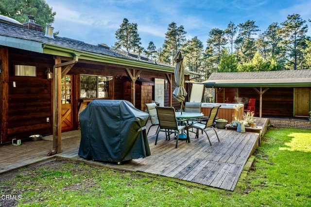 view of patio / terrace featuring a hot tub, a deck, and grilling area