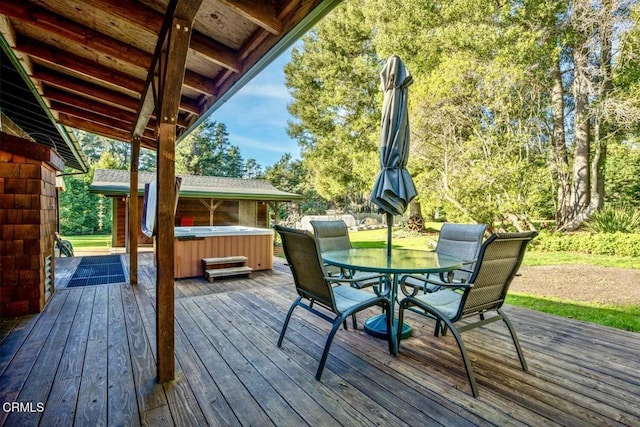 wooden deck featuring a hot tub