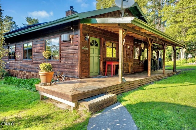 exterior space featuring a yard and a deck