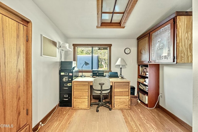 office with light hardwood / wood-style flooring