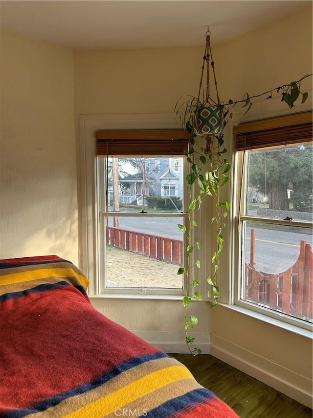 unfurnished bedroom featuring dark hardwood / wood-style flooring