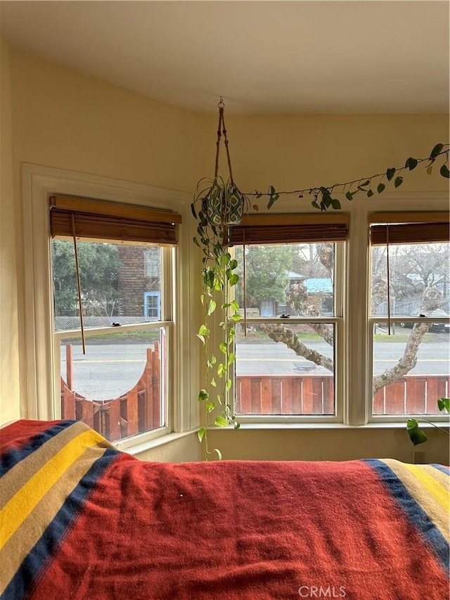 bedroom featuring multiple windows