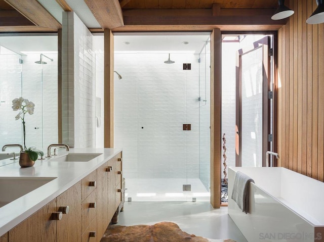 bathroom with vanity and plus walk in shower