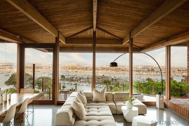 unfurnished sunroom featuring a water view, vaulted ceiling with beams, and wooden ceiling