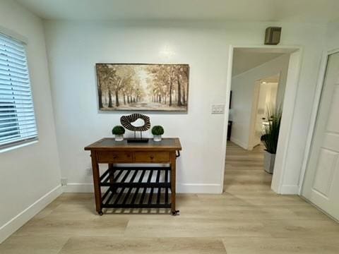 hall with light wood-type flooring