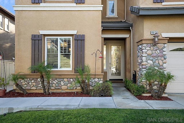 entrance to property featuring a garage