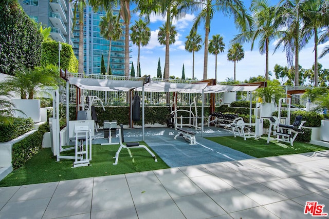 exterior space with a playground and a yard