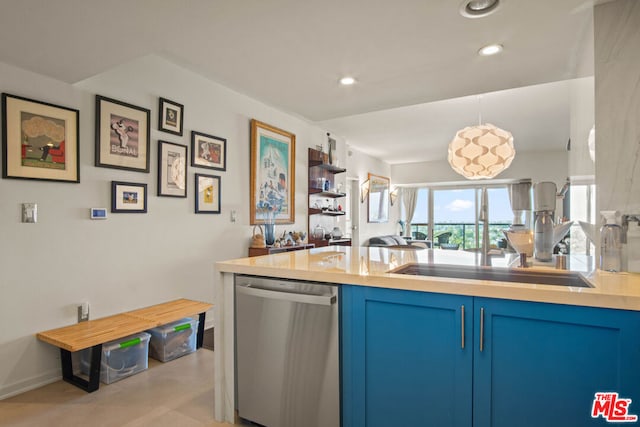 kitchen featuring stainless steel dishwasher, blue cabinets, and sink