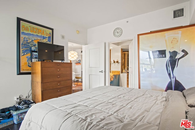 bedroom featuring ensuite bath