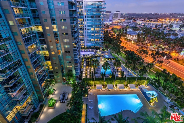 view of pool at dusk