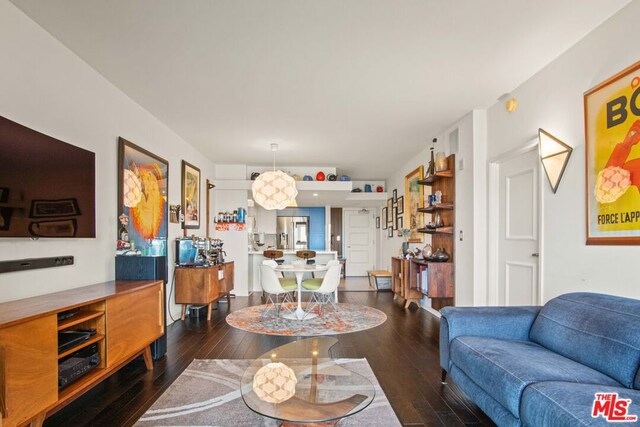 living room featuring dark hardwood / wood-style flooring