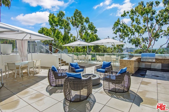 view of patio with area for grilling and grilling area