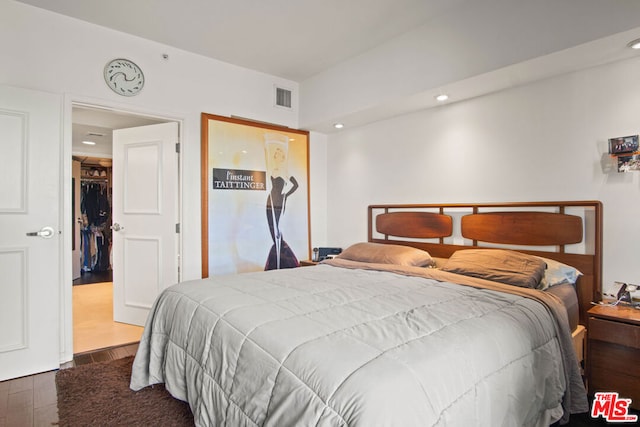 bedroom featuring dark wood-type flooring