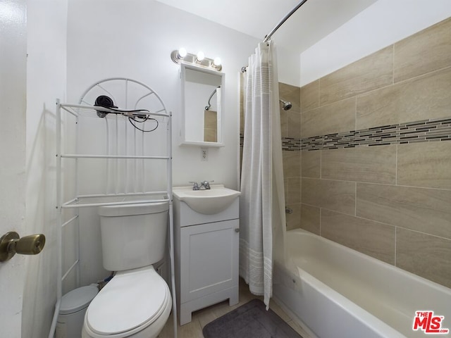 full bathroom with vanity, shower / bath combination with curtain, and toilet