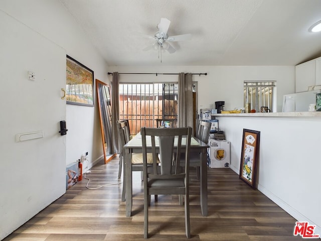 dining space featuring dark hardwood / wood-style floors and ceiling fan