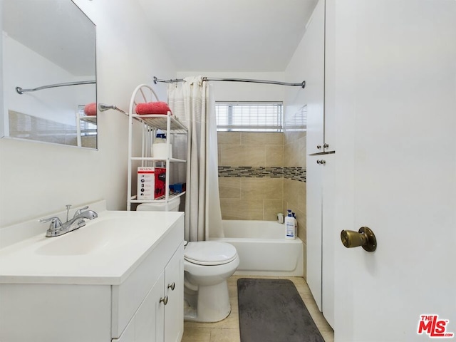 full bathroom featuring vanity, shower / bath combination with curtain, and toilet