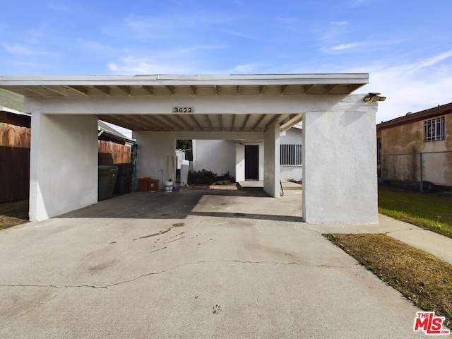 view of parking / parking lot with a carport