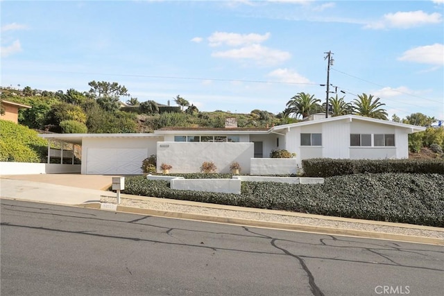 ranch-style house featuring a garage