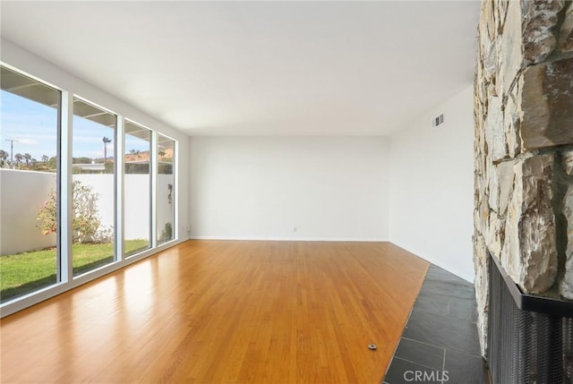 unfurnished room featuring hardwood / wood-style floors