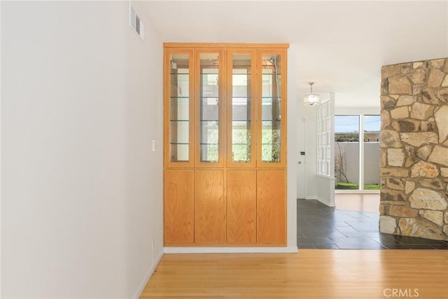 entryway with dark hardwood / wood-style floors