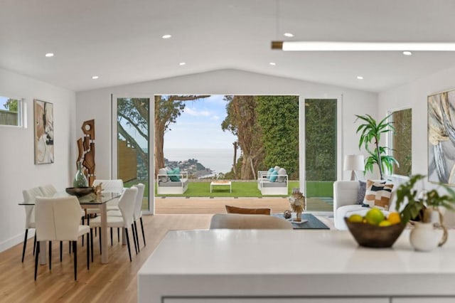 kitchen with lofted ceiling and light hardwood / wood-style flooring