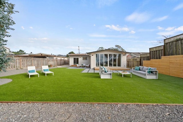 back of property featuring a yard, an outdoor hangout area, and a patio