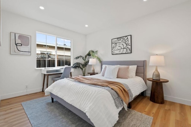 bedroom with light hardwood / wood-style floors