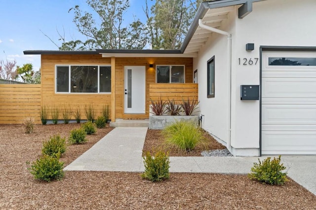 entrance to property featuring a garage