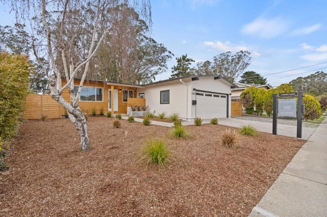 ranch-style home featuring a garage